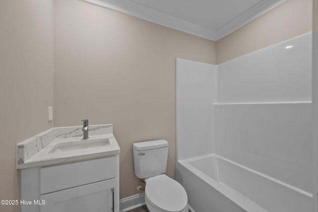 bathroom with vanity, toilet, and ornamental molding