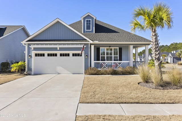 view of front facade with a garage and a porch