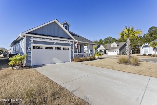 view of front of house featuring a garage and a porch