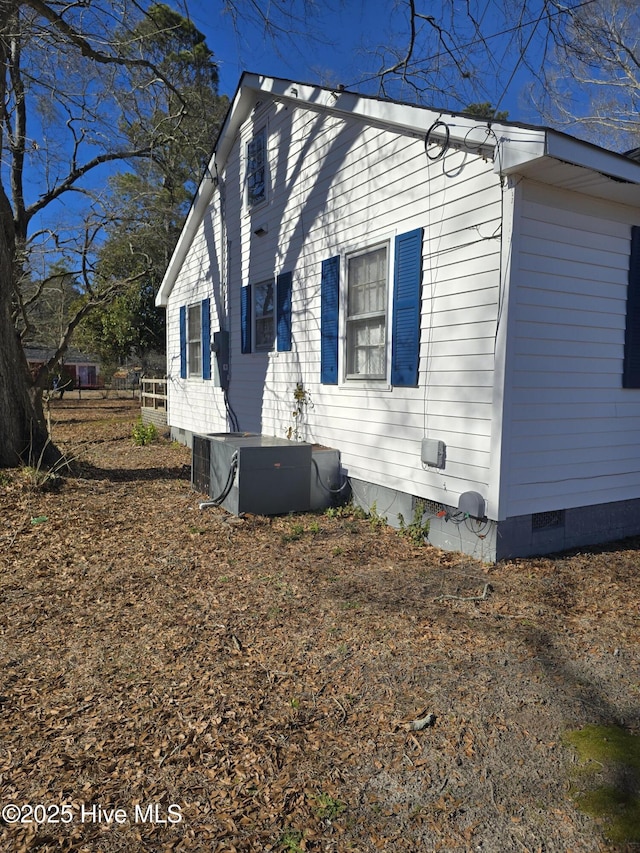 view of property exterior with central AC unit