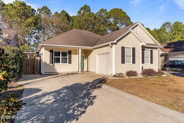 view of front of home with a front yard and a garage