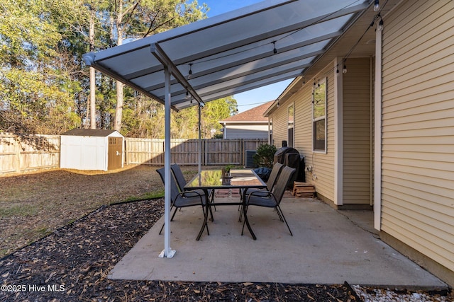 view of patio / terrace with a shed