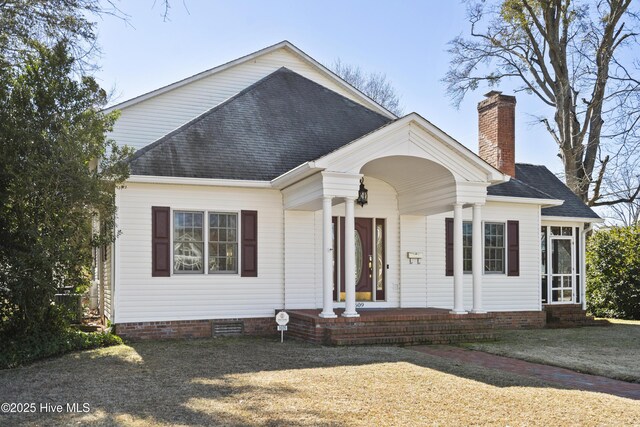 view of front of home featuring a sunroom