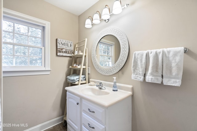 bathroom with baseboards and vanity