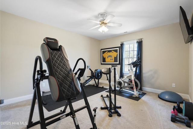 workout room featuring light carpet, ceiling fan, visible vents, and baseboards