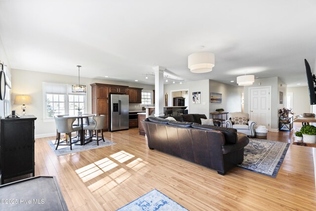 dining area with an inviting chandelier and hardwood / wood-style flooring