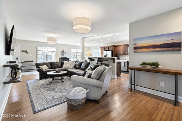 sunroom featuring ceiling fan