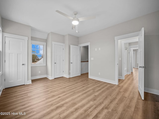 unfurnished bedroom featuring ceiling fan and light hardwood / wood-style floors