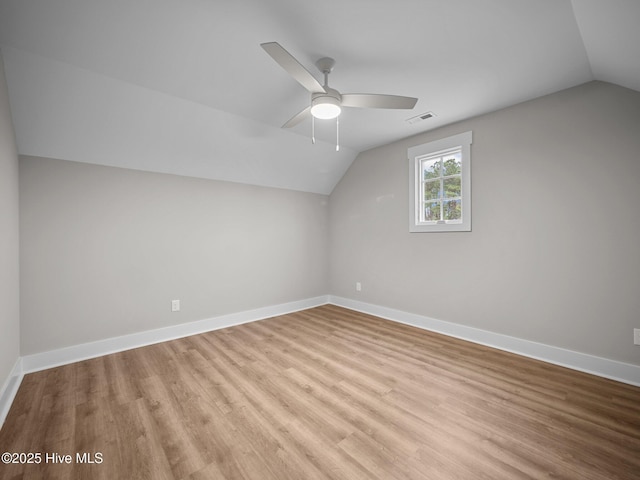 bonus room with light hardwood / wood-style floors, ceiling fan, and lofted ceiling