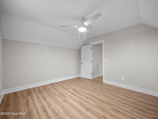 additional living space with ceiling fan, light hardwood / wood-style floors, and vaulted ceiling