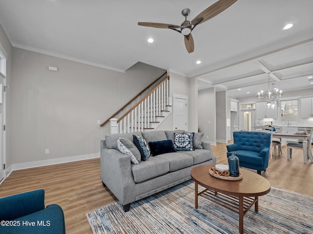 living room featuring coffered ceiling, beamed ceiling, crown molding, ceiling fan with notable chandelier, and light wood-type flooring