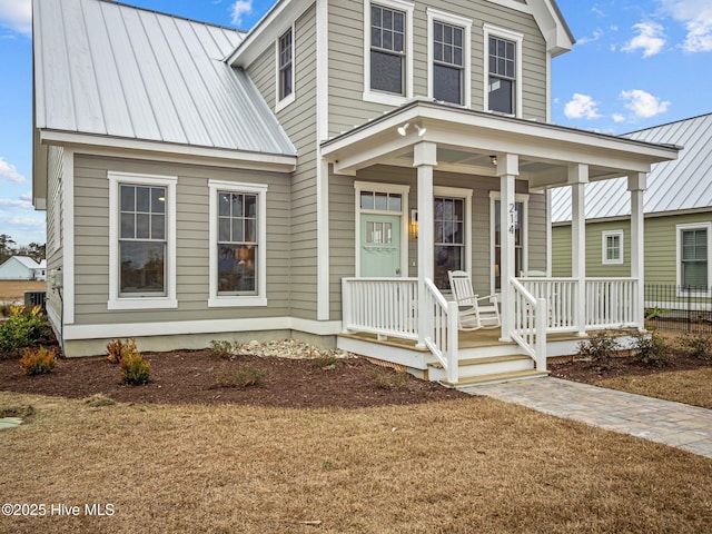 view of front of property with a front lawn and a porch