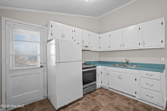 kitchen with electric range, white cabinetry, a sink, and freestanding refrigerator