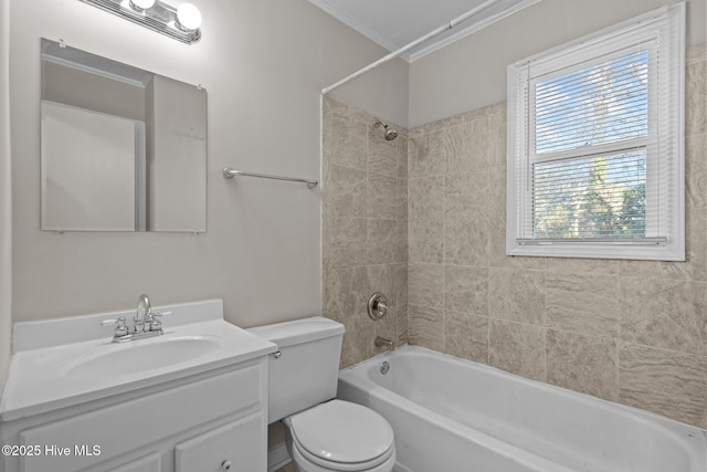 bathroom featuring toilet, washtub / shower combination, ornamental molding, and vanity