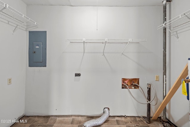 clothes washing area featuring hookup for a washing machine, electric panel, laundry area, and electric dryer hookup