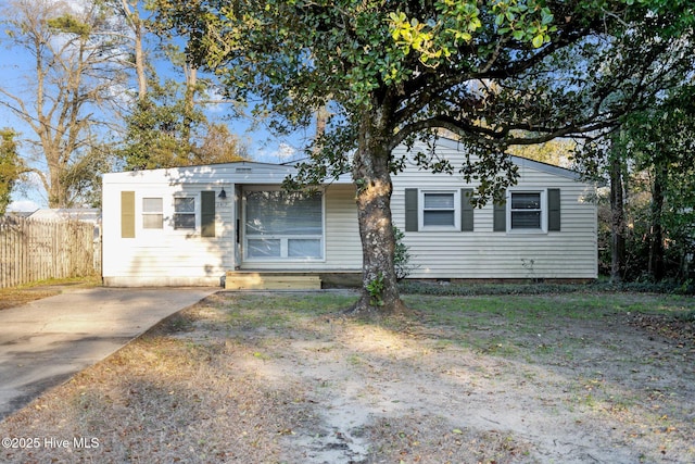 view of front of house featuring fence