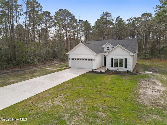 view of front of property featuring a garage and a front lawn