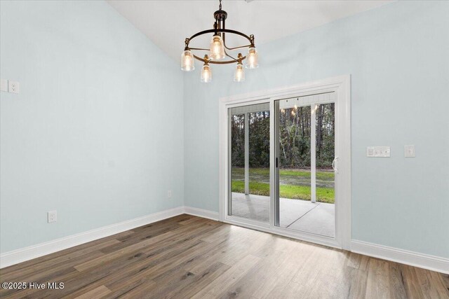 unfurnished living room featuring sink, ceiling fan with notable chandelier, light hardwood / wood-style flooring, and high vaulted ceiling