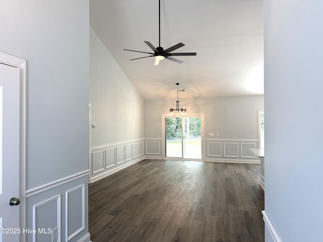 657 Boundary Loop NW, Carolina Shores, NC 28467 - spare room with a decorative wall, ceiling fan, dark wood-type flooring, lofted ceiling, and a wainscoted wall