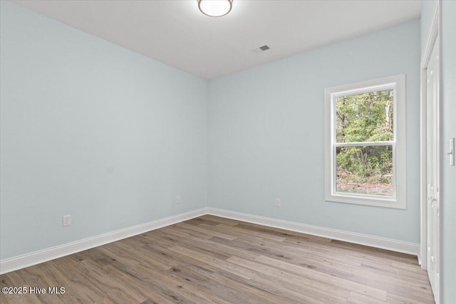 unfurnished room featuring light hardwood / wood-style floors