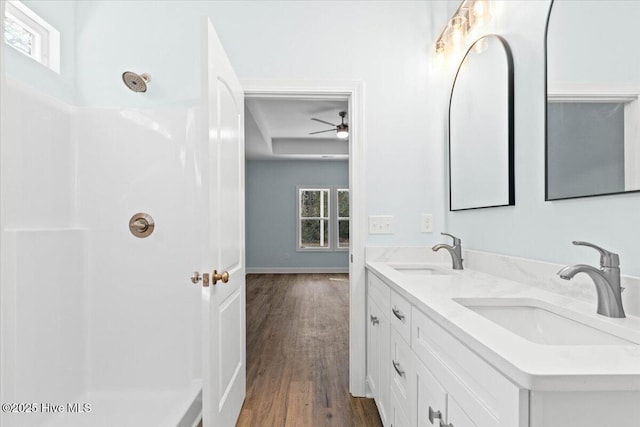 657 Boundary Loop NW, Carolina Shores, NC 28467 - bathroom with wood finished floors, healthy amount of natural light, a shower, and double vanity