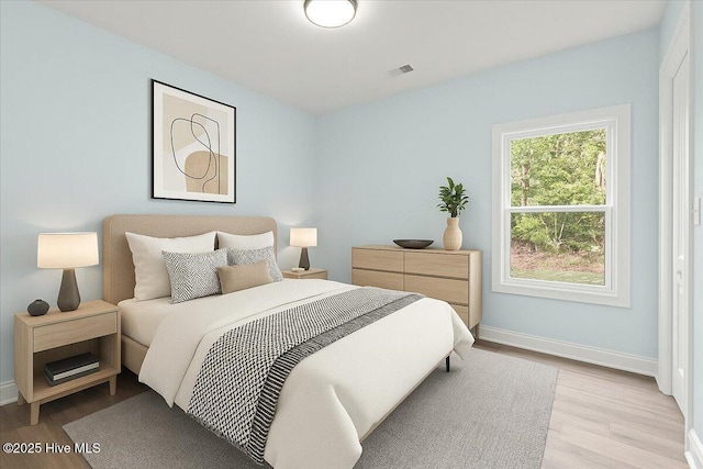 657 Boundary Loop NW, Carolina Shores, NC 28467 - bedroom featuring light wood-type flooring and baseboards
