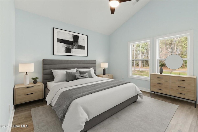 657 Boundary Loop NW, Carolina Shores, NC 28467 - bedroom with wood finished floors, baseboards, high vaulted ceiling, and a ceiling fan