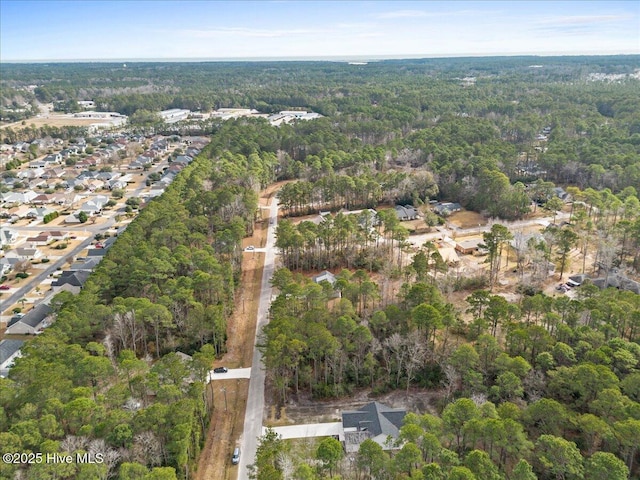 657 Boundary Loop NW, Carolina Shores, NC 28467 - aerial overview of property's location with a forest