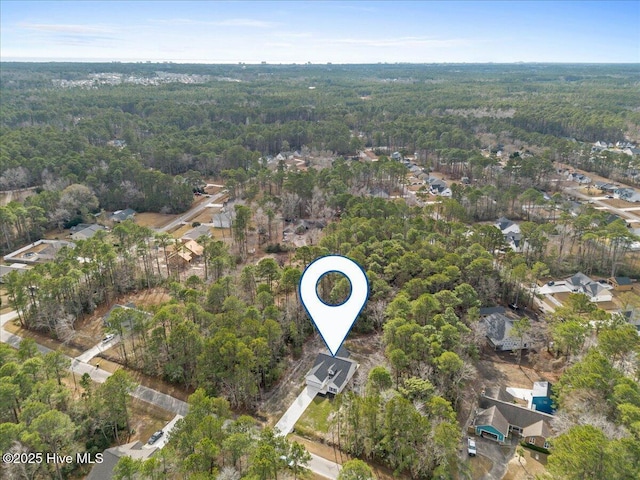 657 Boundary Loop NW, Carolina Shores, NC 28467 - aerial view of property and surrounding area with a forest