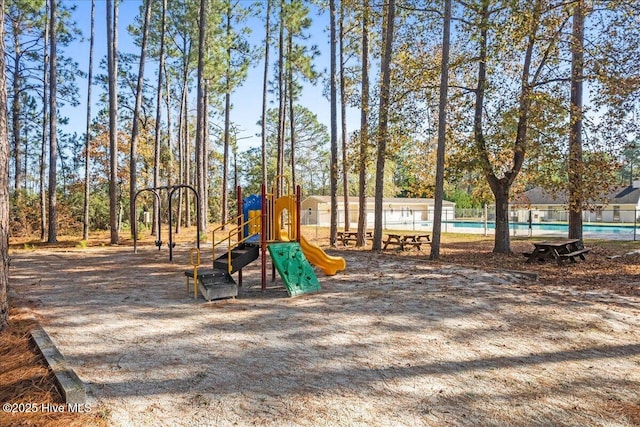 657 Boundary Loop NW, Carolina Shores, NC 28467 - community jungle gym featuring a community pool