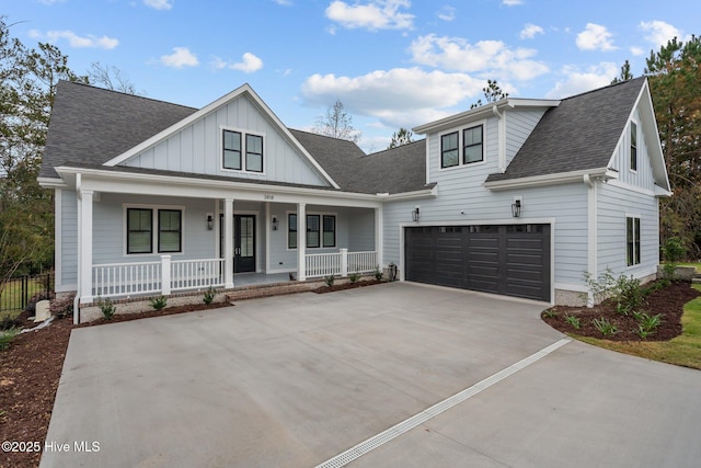 view of front of house with a garage and a porch