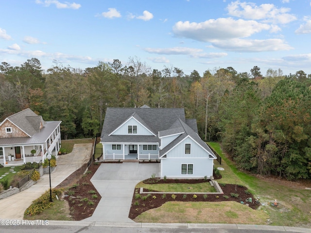 view of front of home featuring covered porch and a front lawn