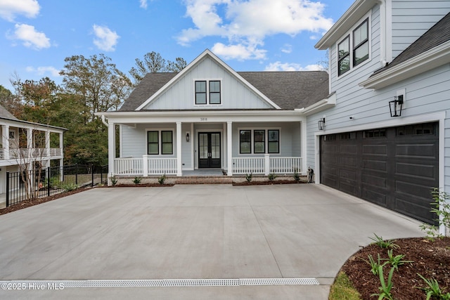 view of front of property featuring a garage and a porch