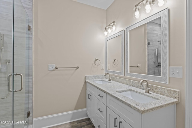 bathroom featuring walk in shower and vanity