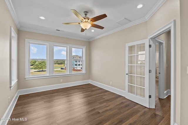 empty room featuring ceiling fan, dark hardwood / wood-style flooring, and ornamental molding