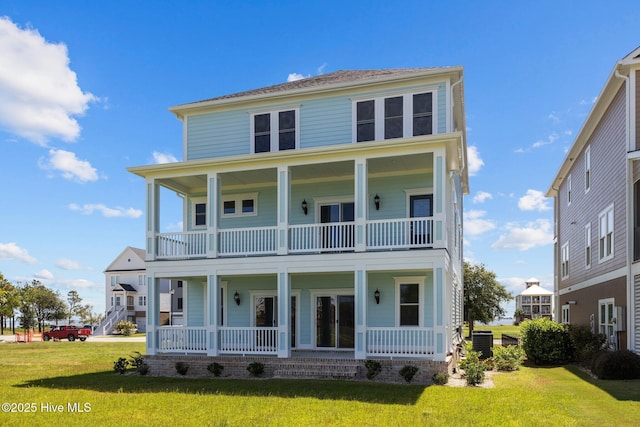 view of front facade with a balcony, a front lawn, a porch, and central air condition unit