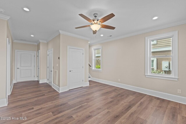 unfurnished room with ceiling fan, dark hardwood / wood-style floors, and ornamental molding