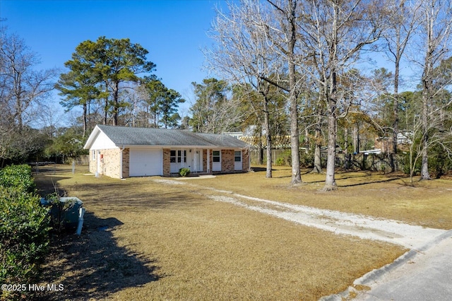 view of front of home with a garage and a front yard