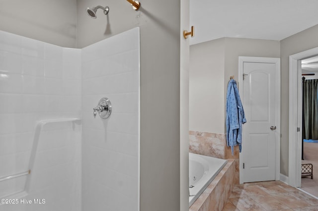 bathroom featuring shower with separate bathtub