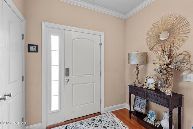 entryway with crown molding and hardwood / wood-style floors