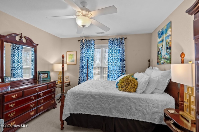 bedroom with ceiling fan and light colored carpet