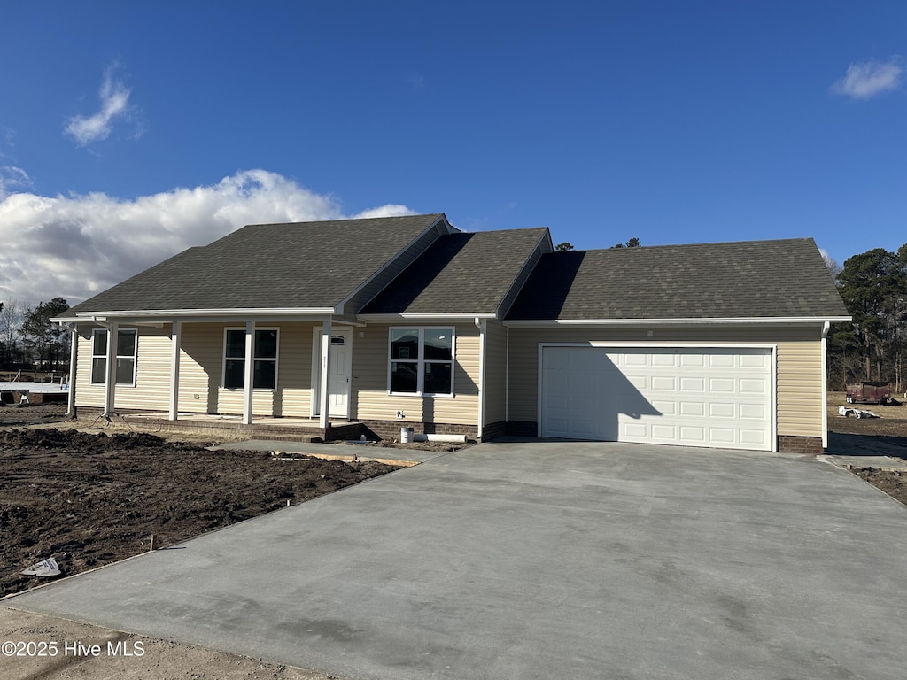 view of front of home featuring a garage and covered porch