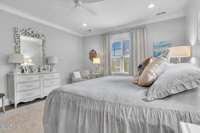 bedroom featuring ceiling fan and crown molding