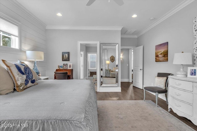 bedroom with ceiling fan, wood-type flooring, and ornamental molding