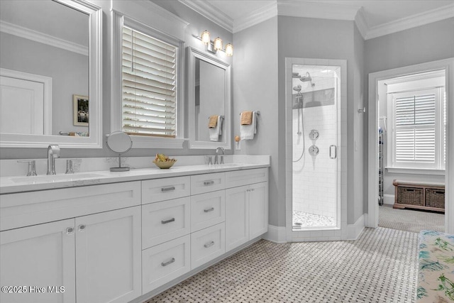 bathroom featuring vanity, ornamental molding, and walk in shower