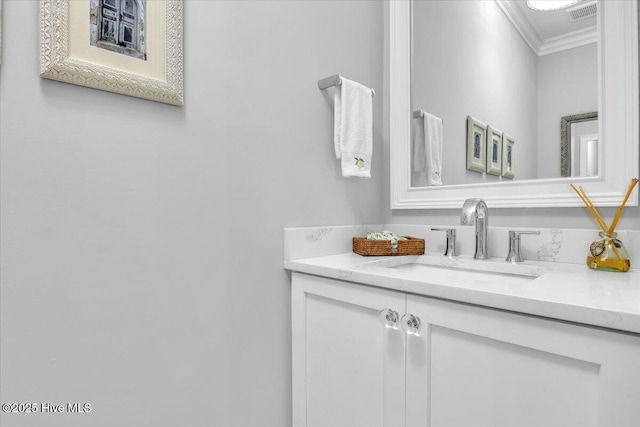 bathroom with vanity and crown molding