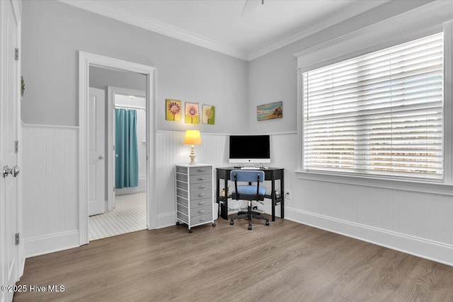 office space featuring hardwood / wood-style floors and crown molding