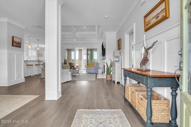 foyer entrance with beamed ceiling, dark hardwood / wood-style flooring, crown molding, and coffered ceiling