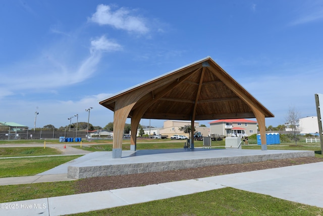 view of property's community with a gazebo and a yard