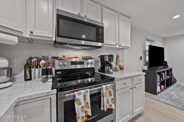 kitchen featuring white cabinetry, sink, and stainless steel appliances